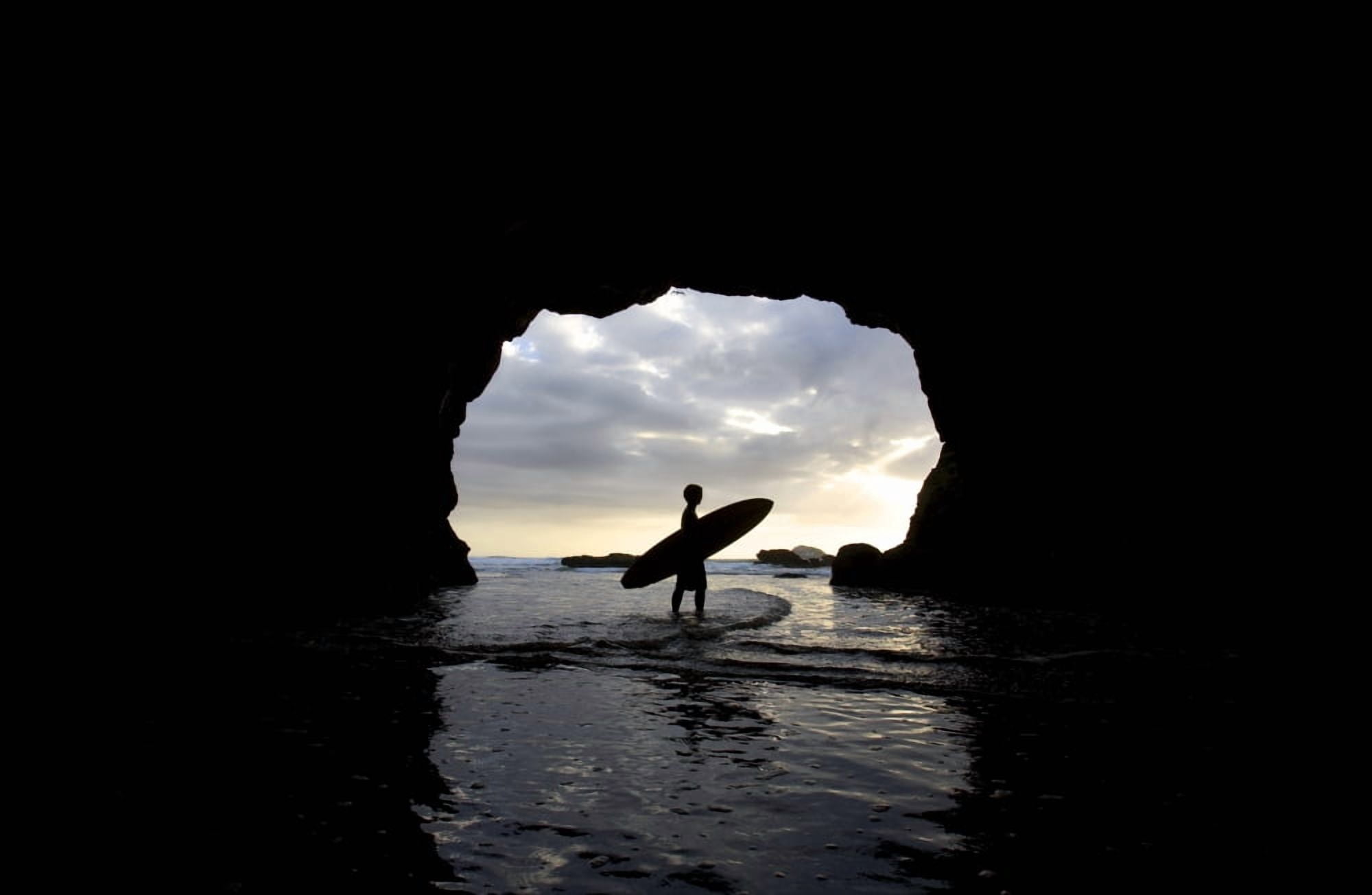 Surfer Inside A Cave At Muriwai New Zealand Canvas Art - Deddeda Design Pics (34 x 22)