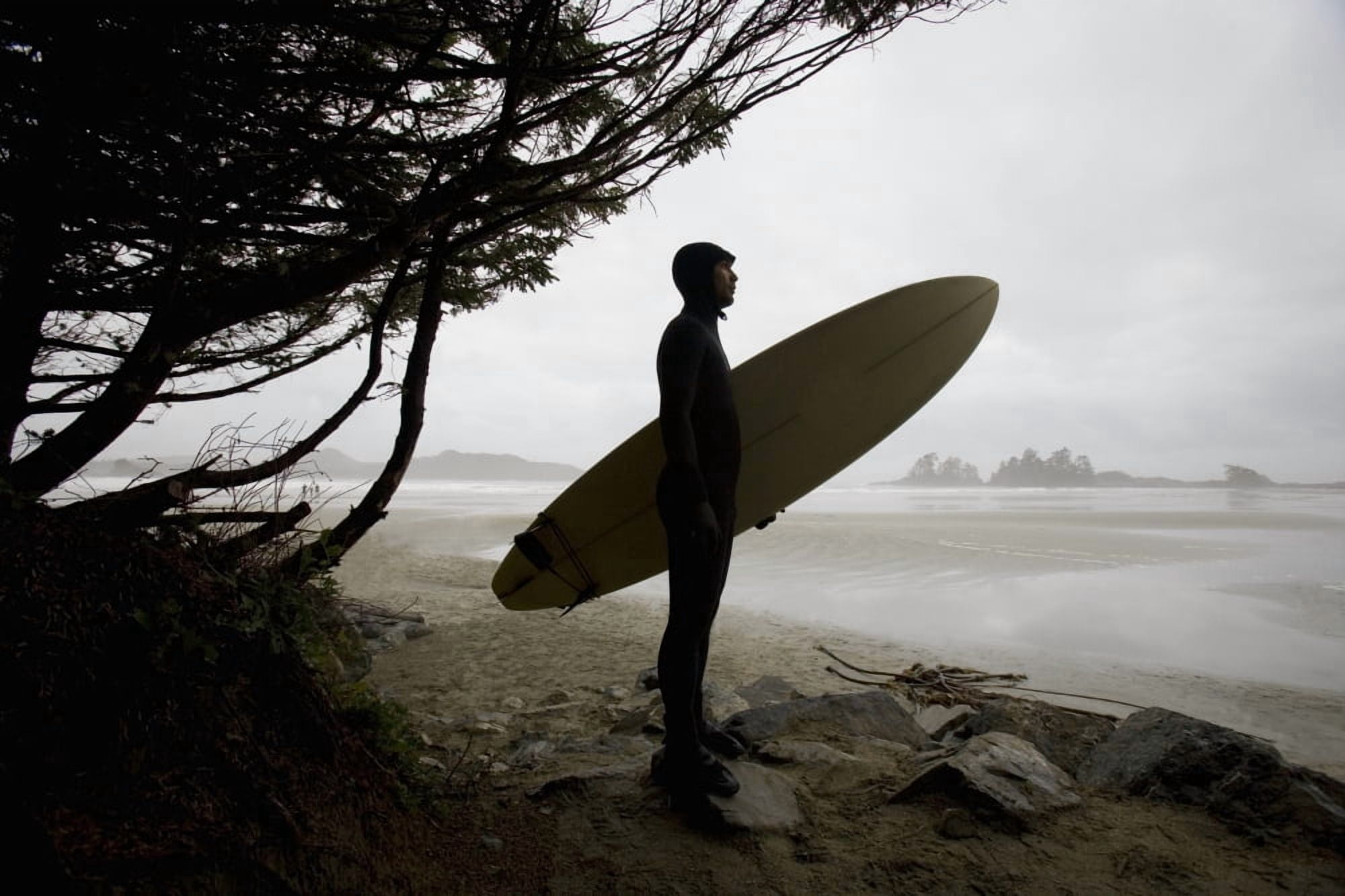Surfer Observing Water From The Beach Canvas Art - Deddeda Design Pics (34 x 22)