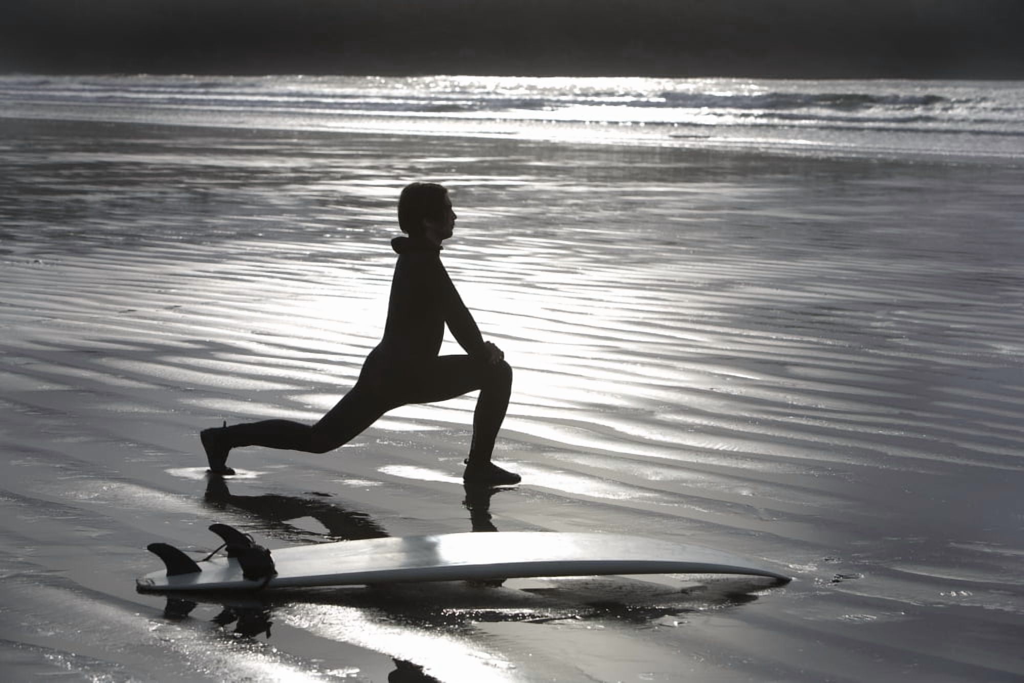 Surfer Stretching On Beach Canvas Art - Deddeda Design Pics (17 x 11)