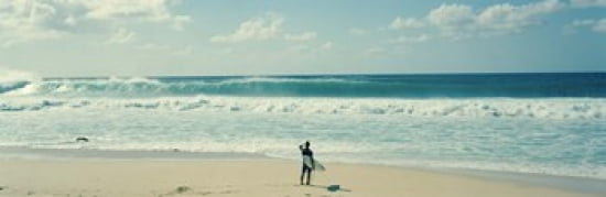 Surfer standing on the beach North Shore Oahu Hawaii USA Canvas Art - Panoramic Images (36 x 12)