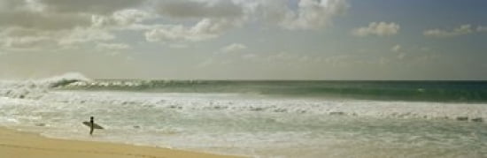 Surfer standing on the beach North Shore Oahu Hawaii USA Canvas Art - Panoramic Images (36 x 12)