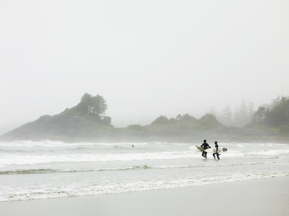 Surfers Walking On The Beach In Cox Bay British Columbia Canada Canvas Art - Ian Grant Design Pics (17 x 13)