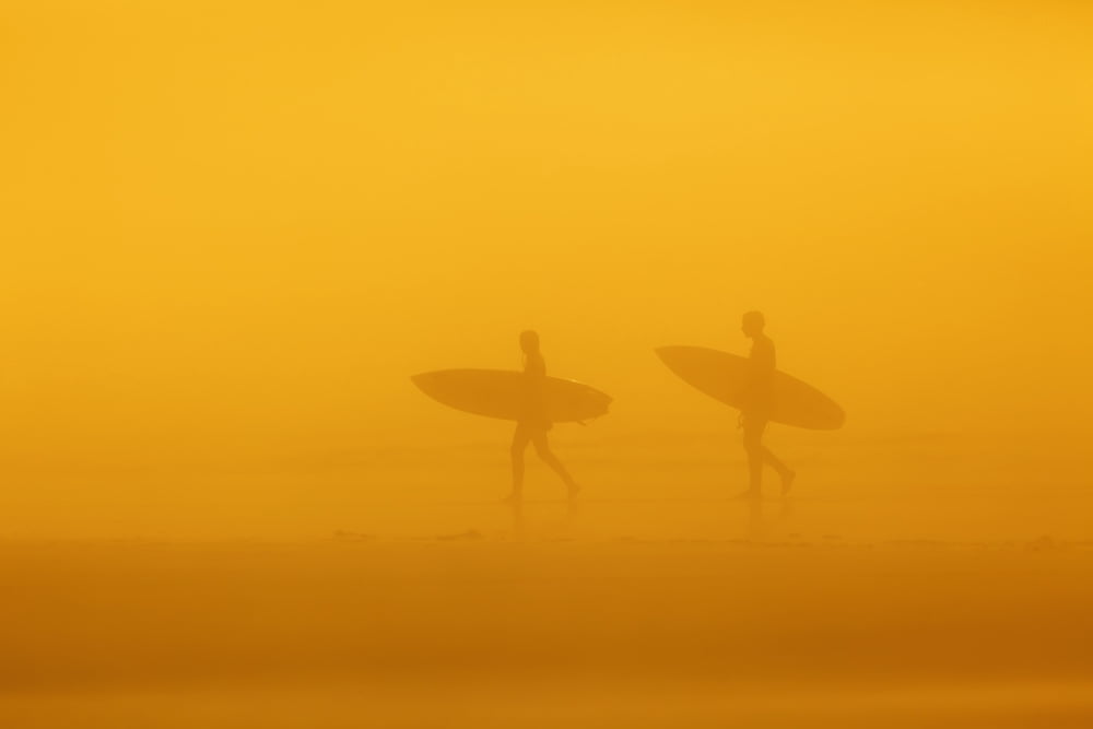 Surfers in the fog on long beach pacific rim national parkVancouver island british columbia canada Canvas Art - Ken Gillespie Design Pics (38 x 24)