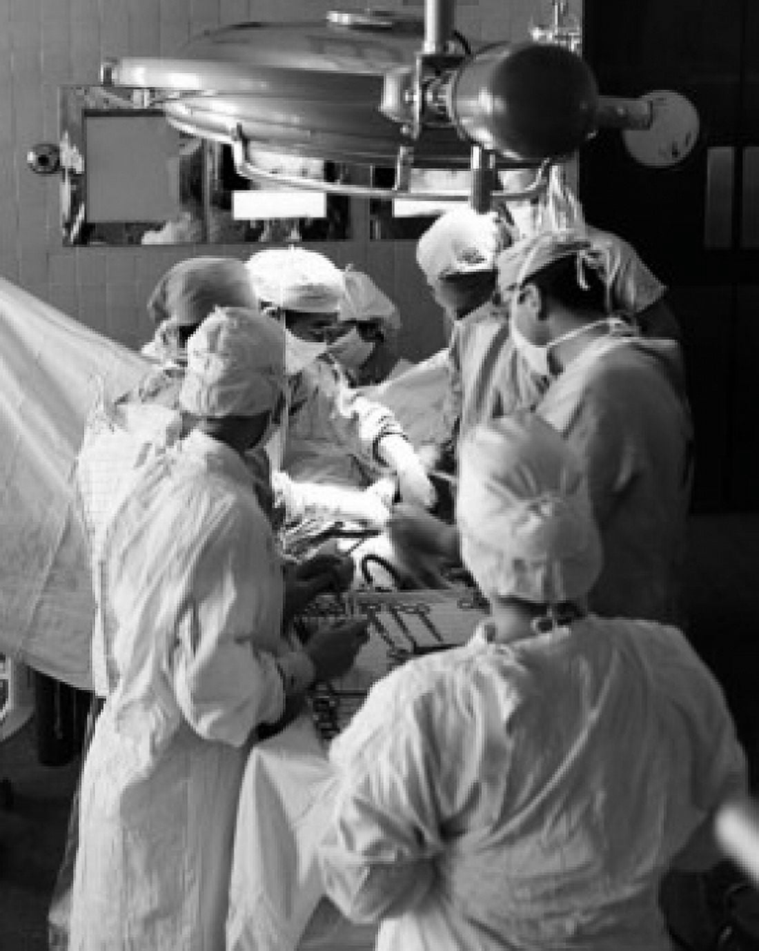 Surgeons performing a surgery in an operating room Canvas Art - (24 x 36)