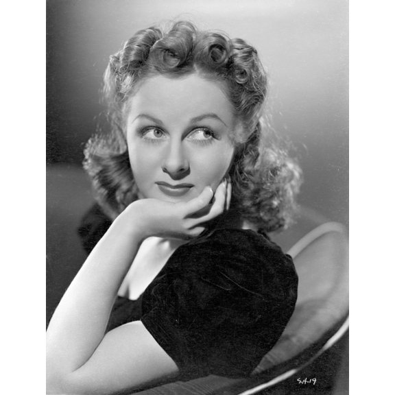 Susan Hayward sitting and Face Leaning on Hand on Chair in Black Dress Photo Print (24 x 30)