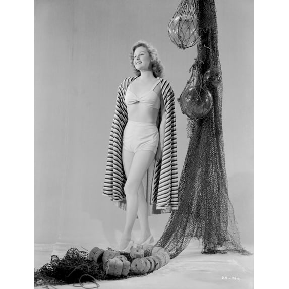 Susan Hayward wearing a Swimsuit with a Stripe Cloth Photo Print (24 x 30)