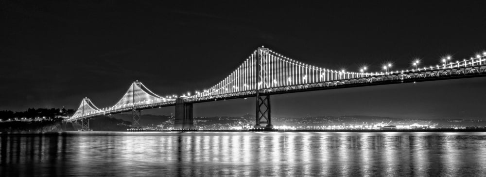Suspension bridge over Pacific ocean lit up at night Bay Bridge San Francisco Bay San Francisco California USA Canvas Art - Panoramic Images (13 x 36)