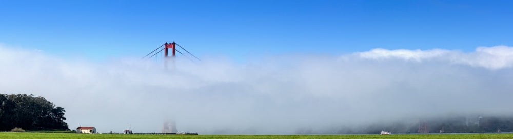 Suspension bridge covered with fog Golden Gate Bridge San Francisco Bay San Francisco California USA Canvas Art - Panoramic Images (6 x 21)