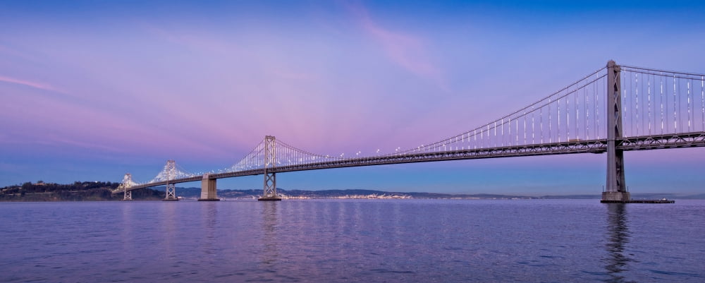 Suspension bridge over Pacific ocean Bay Bridge San Francisco Bay San Francisco California USA Canvas Art - Panoramic Images (12 x 30)