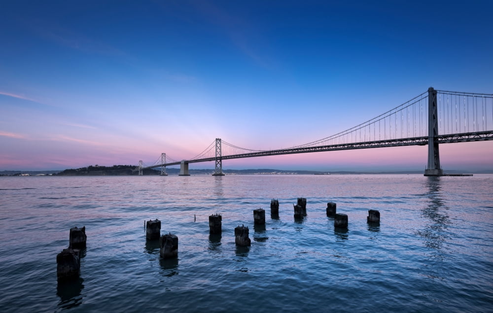 Suspension bridge over Pacific ocean Bay Bridge San Francisco Bay San Francisco California USA Canvas Art - Panoramic Images (24 x 38)