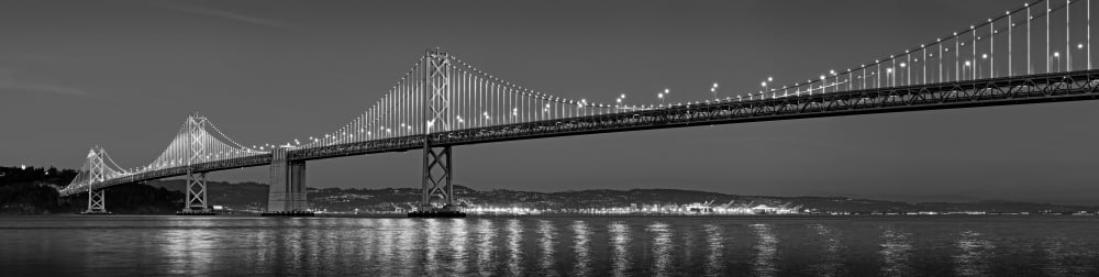 Suspension bridge over Pacific ocean lit up at dusk Bay Bridge San Francisco Bay San Francisco California USA Canvas Art - Panoramic Images (5 x 20)