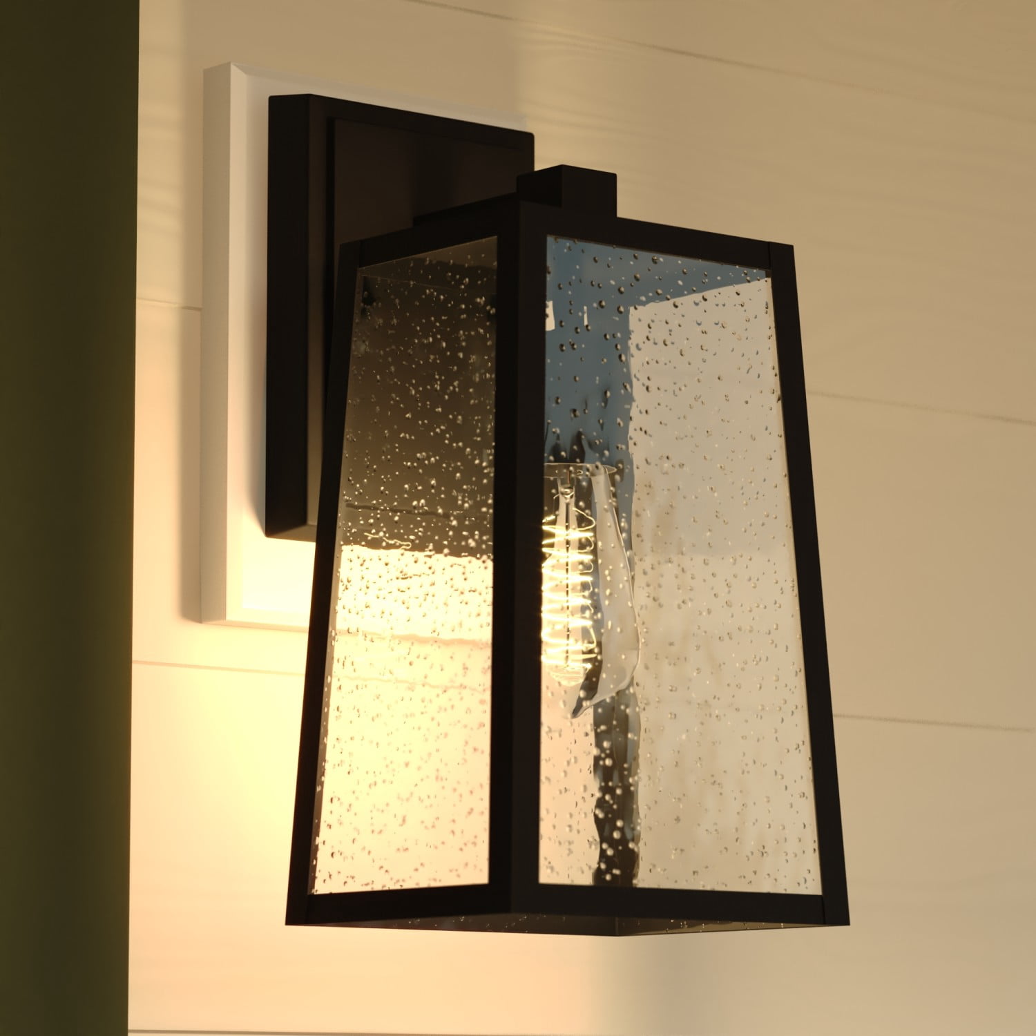 Sutton 14 in. H Black Outdoor Hardwired Sconce Wall Light made of Durable Steel, Clear Seeded Glass