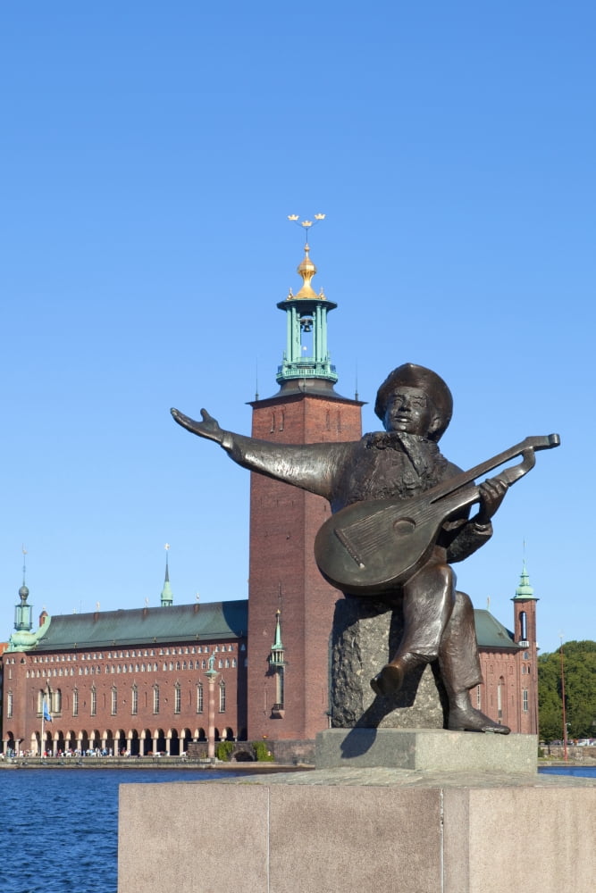 Sweden Stockholm - The Town Hall ( Stadshuset ) and statue of national musician Evert Taube Canvas Art - Panoramic Images (27 x 9)
