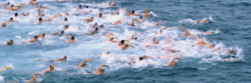 Swimmers in motion at the start of the annual Rough Water Swim event La Jolla San Diego California USA Canvas Art - Panoramic Images (27 x 9)