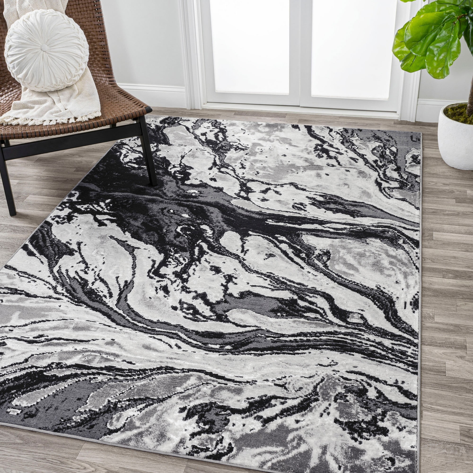 Black and Ivory Abstract Synthetic 4' x 6' Area Rug