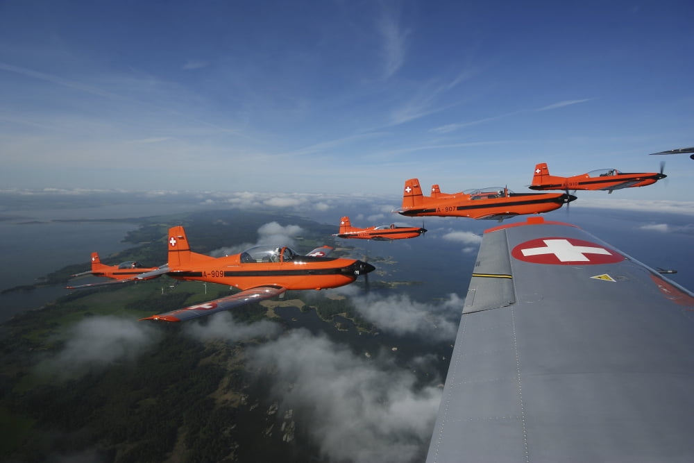 Swiss Air Force display team PC-7 Team flying the Pilatus PC-7 turboprop trainer aircraft Canvas Art - Daniel KarlssonStocktrek Images (35 x 24)