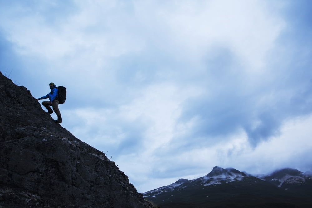 Swiss biologist and photographer climbing on ridge line above Kinak Bay along Katmai Coast Katmai National Park Southwest Alaska Canvas Art - Paul Souders Design Pics (38 x 24)