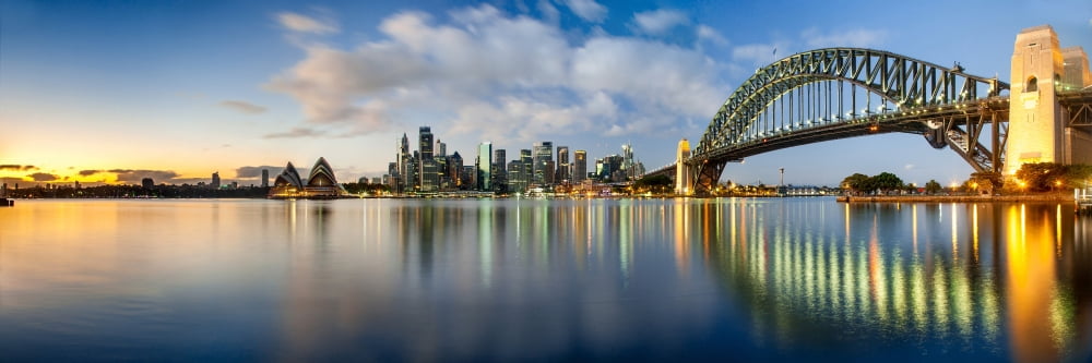 Sydney Harbour Bridge and skylines at dusk Sydney New South Wales Australia Canvas Art - Panoramic Images (6 x 18)