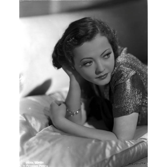 Sylvia Sidney Lying on a Silk Beddings in Shiny Blouse Photo Print (8 x 10)