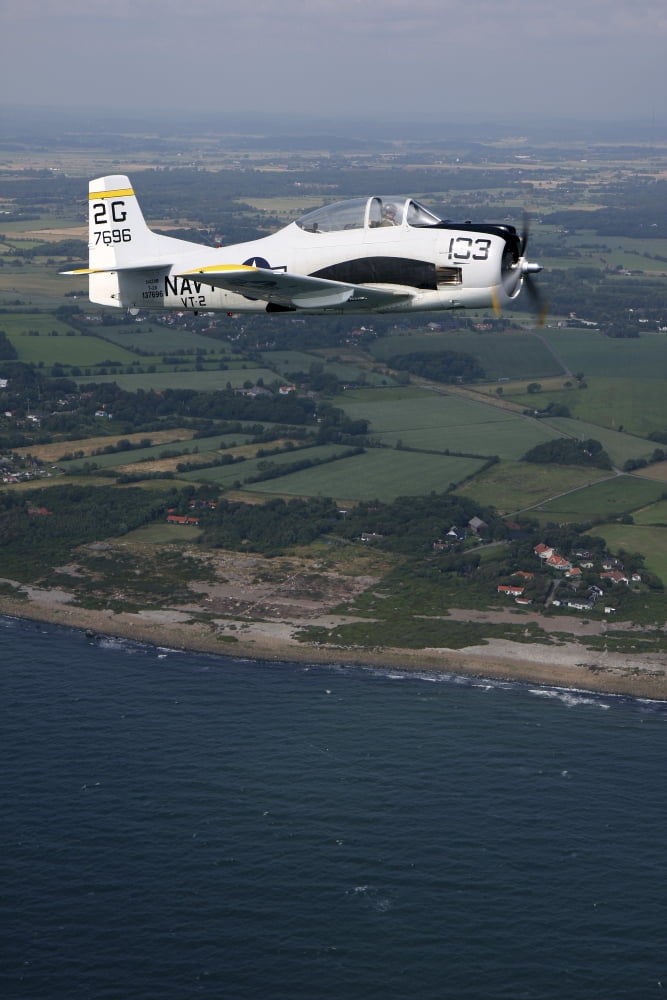 T-28 Trojan trainer warbird in US Navy colors Canvas Art - Daniel KarlssonStocktrek Images (12 x 18)
