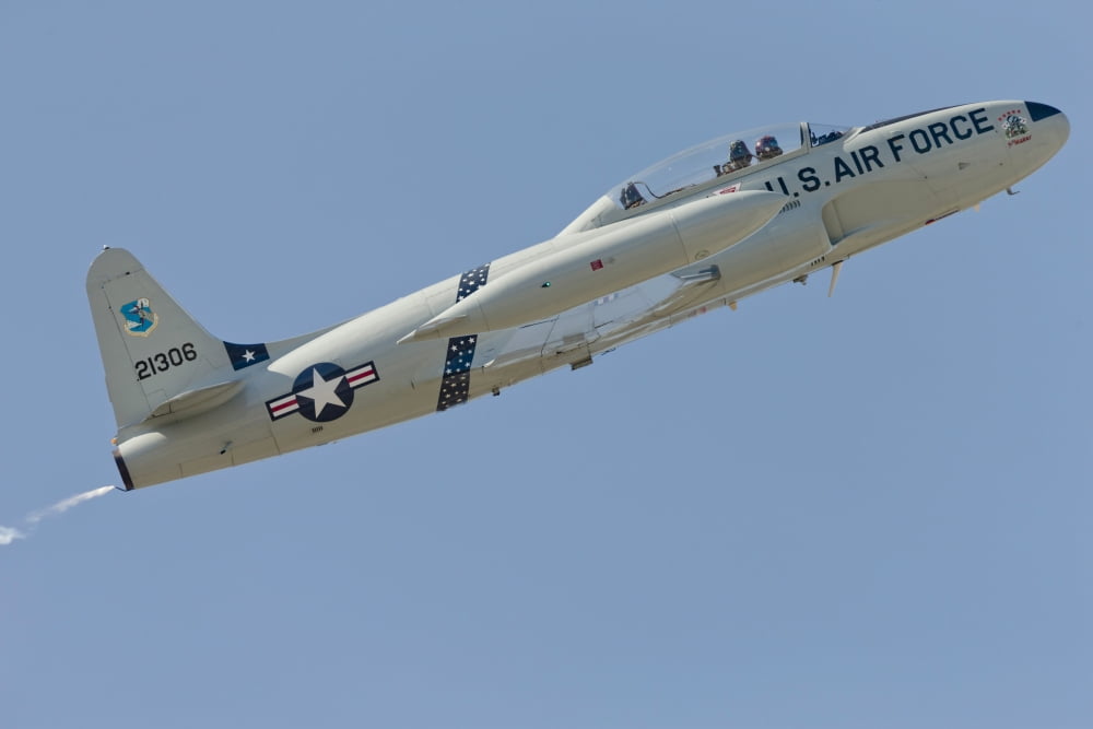 T-33 Shooting Star flying over Watsonville California Canvas Art - Phil WallickStocktrek Images (34 x 23)