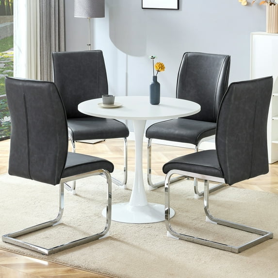 Table and chair set.Hourglass-Shaped Stable Small Round Table -31.9" * 31.9" With 4 Soft and Comfortable Dark Gray PU Chair With Arched Metal Silver Leg.Create Your Exclusive Low-Key Luxury Space.