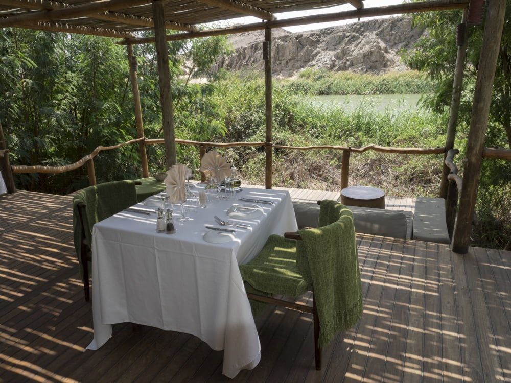 Table for lunch in cabin of Serra Cafema Camp Kunene River Hartmann Valley Kunene Namibia Canvas Art - Panoramic Images (12 x 16)
