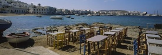 Tables and chairs in a cafe Greece Canvas Art - Panoramic Images (36 x 12)