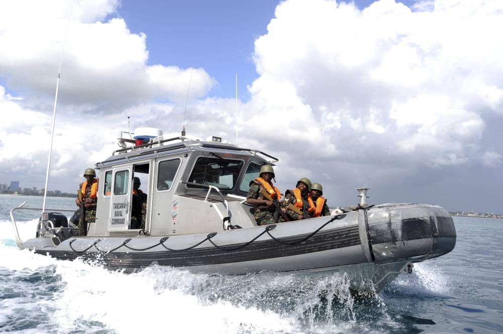 Tanzania Peoples Defense Force sailors pilot their boat Canvas Art - Stocktrek Images (35 x 23)