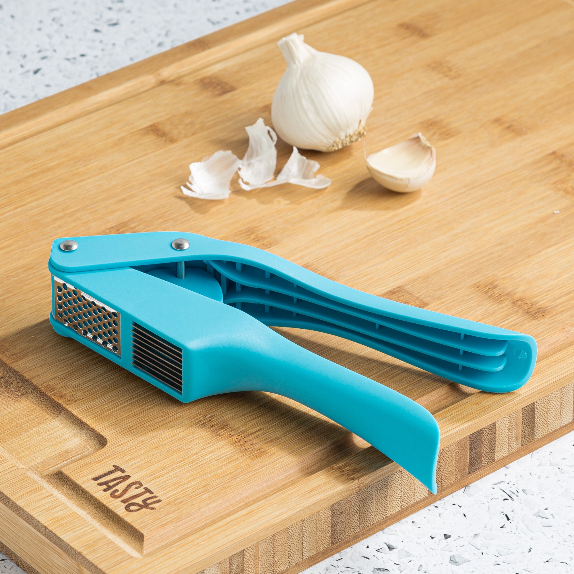 https://i5.walmartimages.com/seo/Tasty-Stainless-Steel-Garlic-Press-with-2-Compartments-for-Mincing-or-Slicing-Tasty-Blue_7b78b625-a179-4798-9e63-624dd24e0113_1.eeb591273a10801a3217592ff8979a15.jpeg