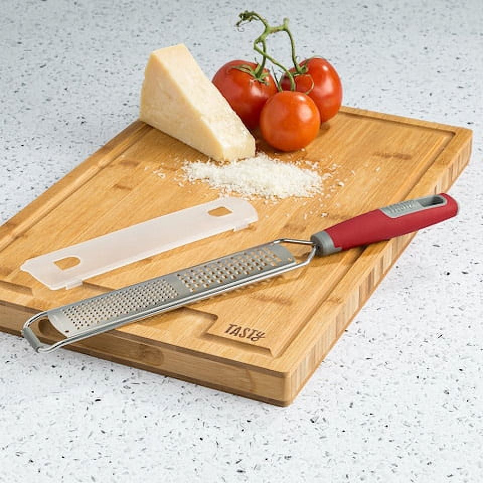 https://i5.walmartimages.com/seo/Tasty-Stainless-Steel-Handheld-Zester-Grater-with-Blade-Guard-Red_d13dc3d8-c698-48ee-aaee-2d65e71b9b84.fe4ae6c418ea8810ce60be67690368f8.jpeg