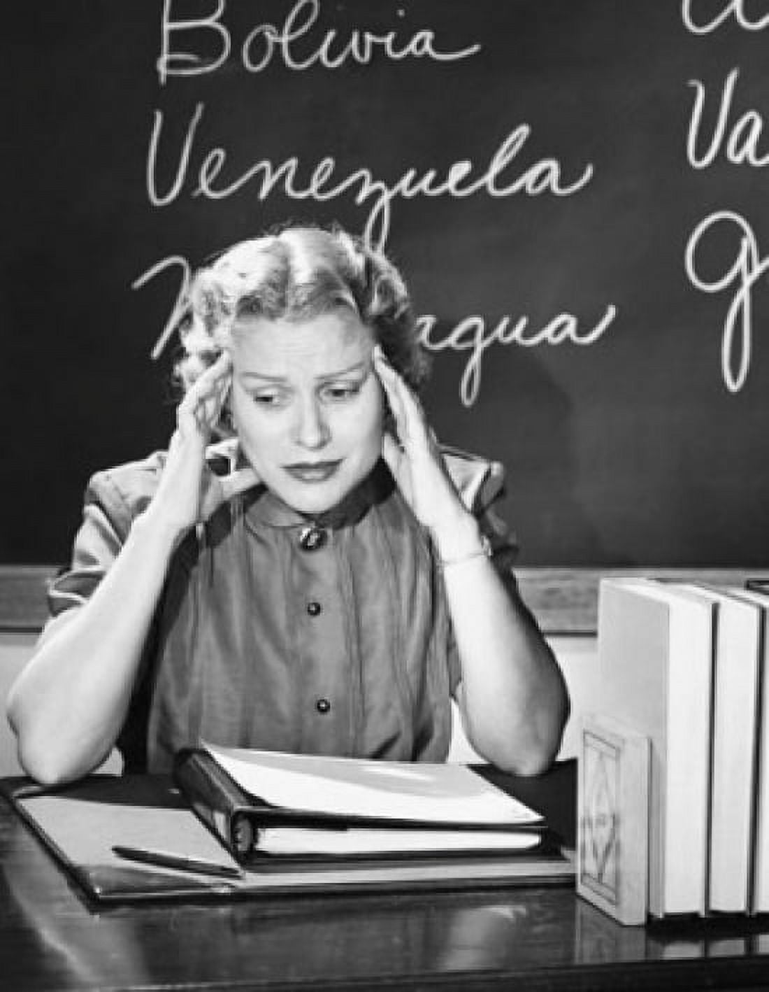 Teacher sitting in a classroom and looking stressed Canvas Art - (24 x 36)