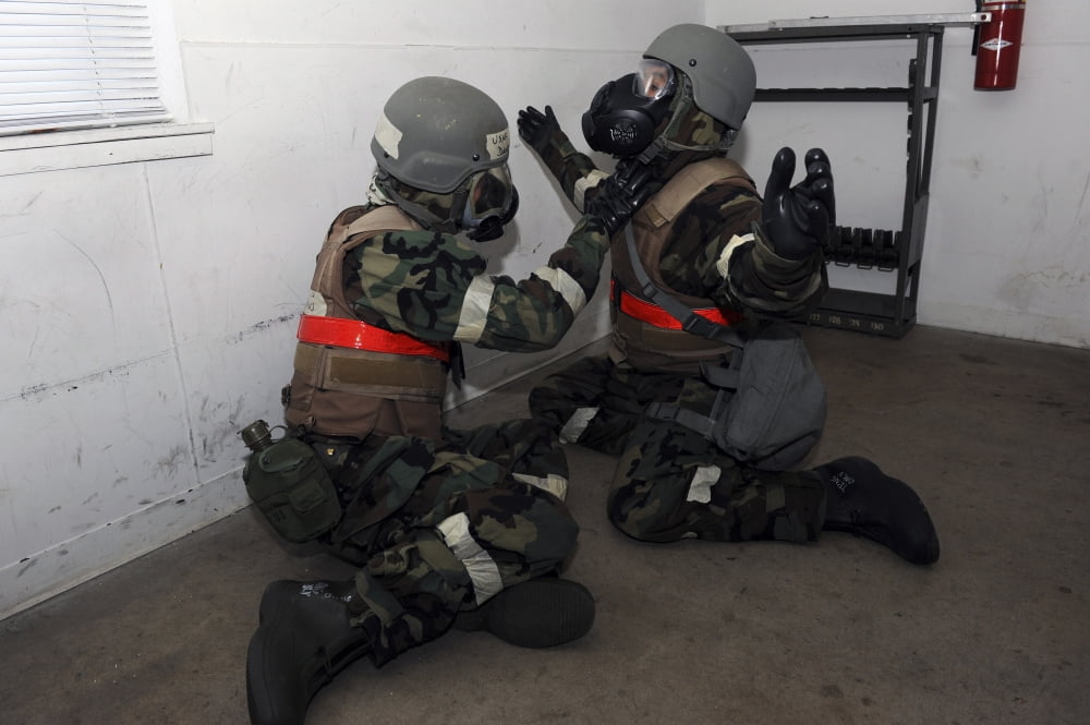 Team Little Rock members perform a buddy check at Little Rock Air Force Base Canvas Art - Stocktrek Images (35 x 23)