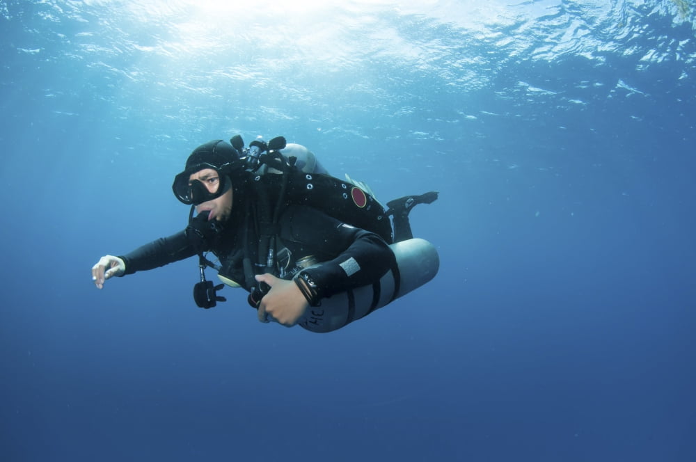 Technical diver with equipment swimming in clear blue water Canvas Art - Karen DoodyStocktrek Images (18 x 12)