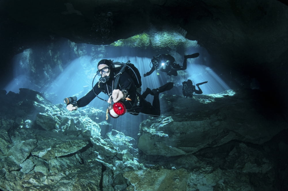 Technical divers enter the cavern system in Mexico Canvas Art - Karen DoodyStocktrek Images (35 x 23)