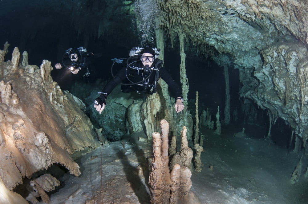 Technical divers in Dreamgate cave system in Mexico Canvas Art - Karen DoodyStocktrek Images (35 x 23)