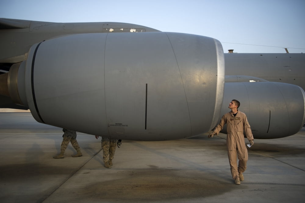 Technician performs a preflight inspection on a KC-135 Stratotanker Canvas Art - Stocktrek Images (35 x 23)