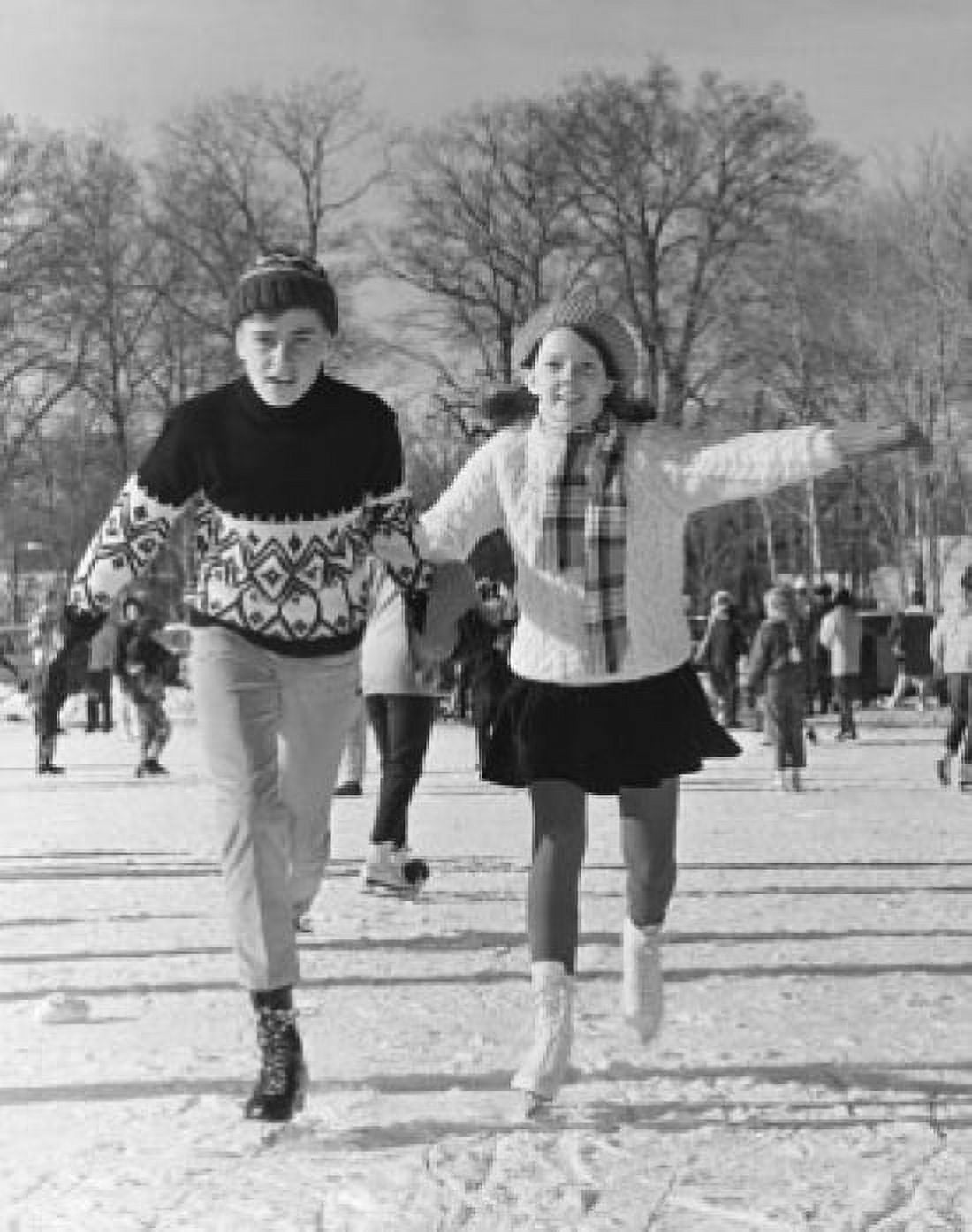 Teenage boy and teenage girl ice skating and holding hands Canvas Art - (18 x 24)