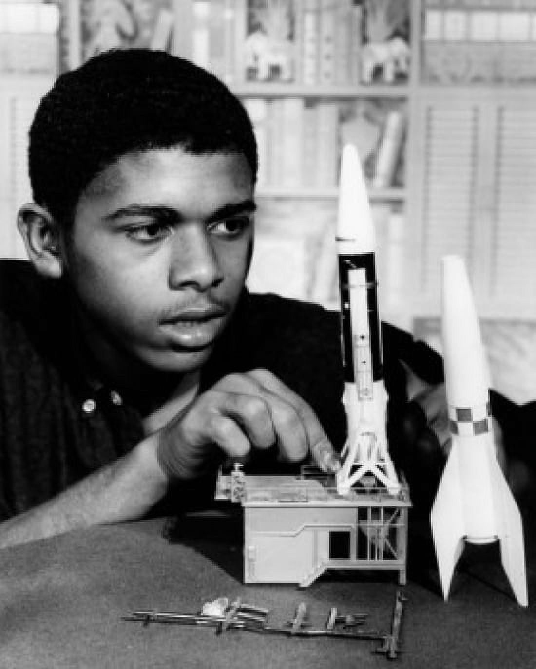 Teenage boy assembling plastic rocket model Canvas Art - (24 x 36)