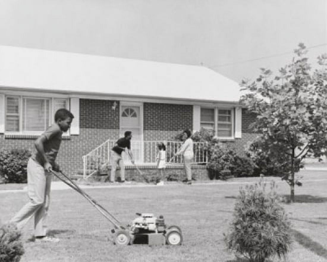 Teenage boy mowing the grass with a lawn mower Canvas Art - (18 x 24)