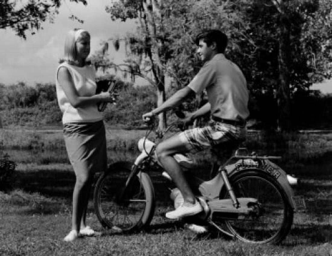 Teenage boy on motorbike talking to teenage girl Canvas Art - (24 x 36)
