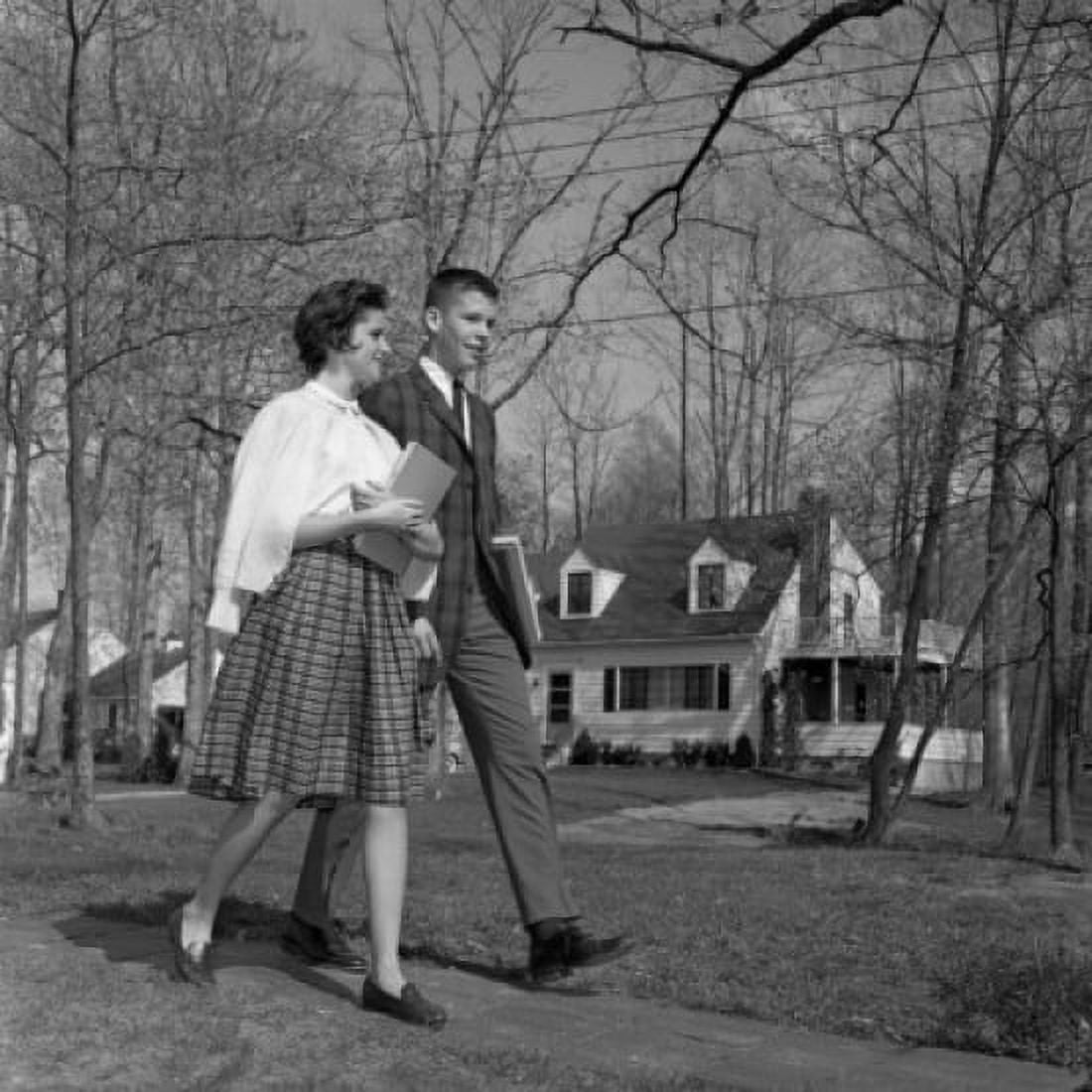 Teenage brother and sister walking in park Canvas Art - (24 x 36)