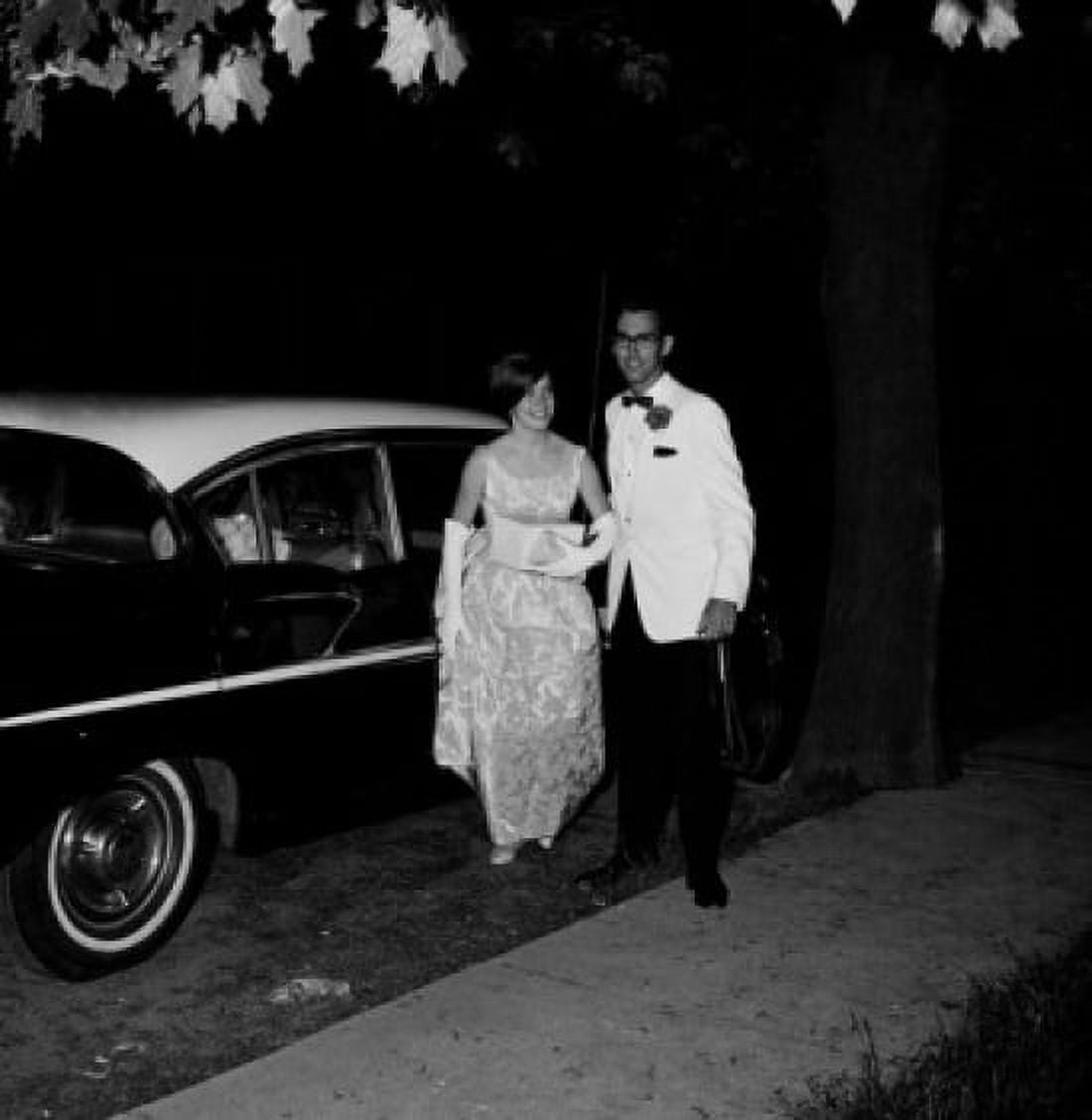 Teenage couple in formal clothes next to car Canvas Art - (24 x 36)