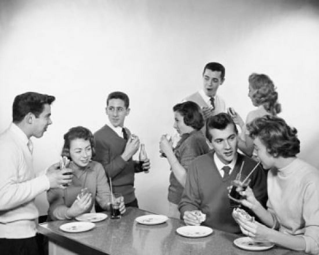 Teenage couples drinking soft drinks and eating burgers Canvas Art -  (24 x 36)