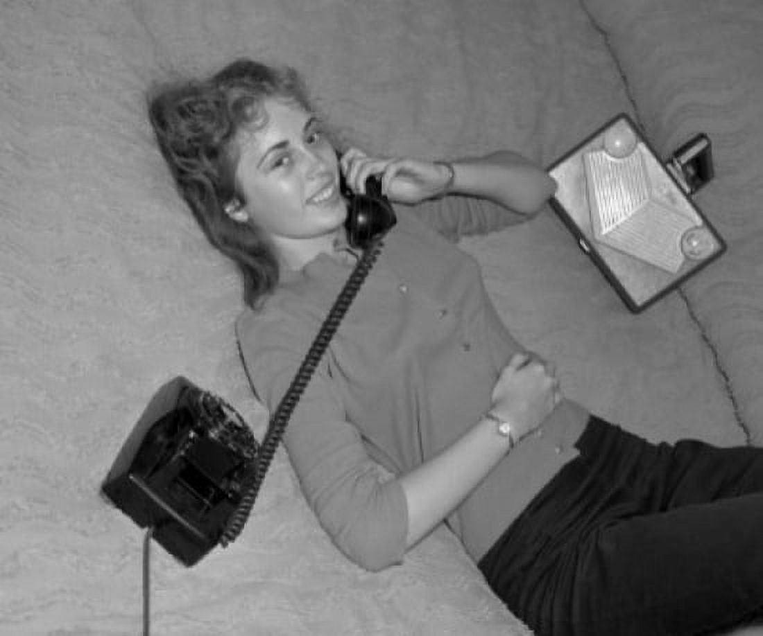 Teenage girl lying on back and talking through phone Canvas Art -  (24 x 36)