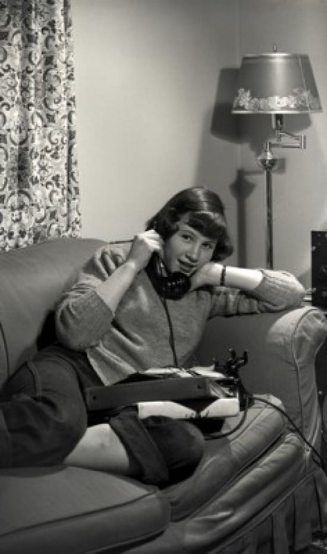 Teenage girl lying on side and talking through phone Canvas Art - (18 x 24)