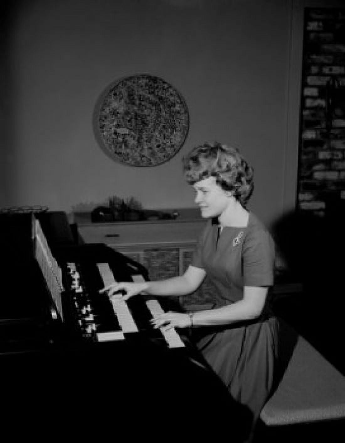 Teenage girl playing organ Canvas Art - (18 x 24)