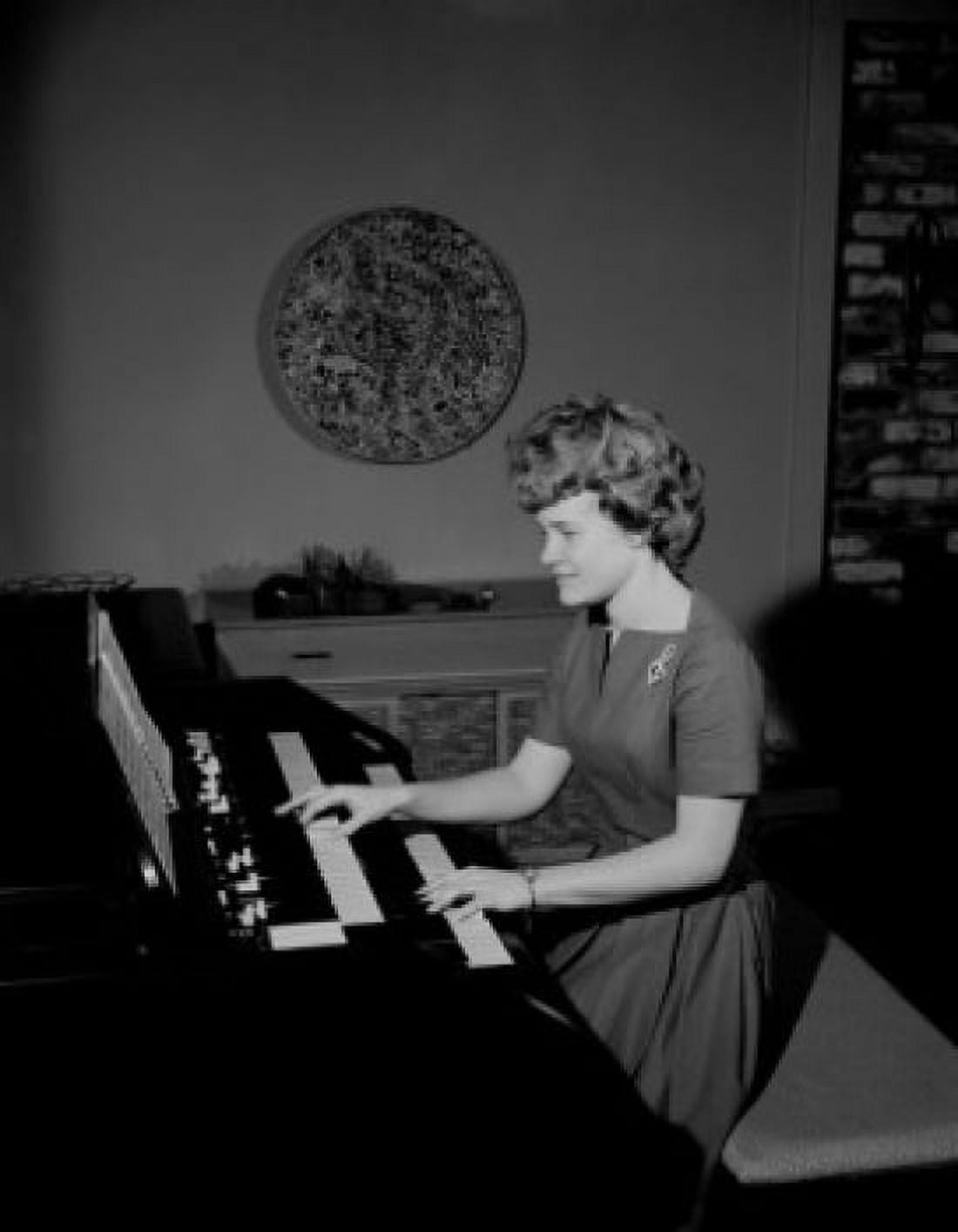 Teenage girl playing organ Canvas Art - (24 x 36)
