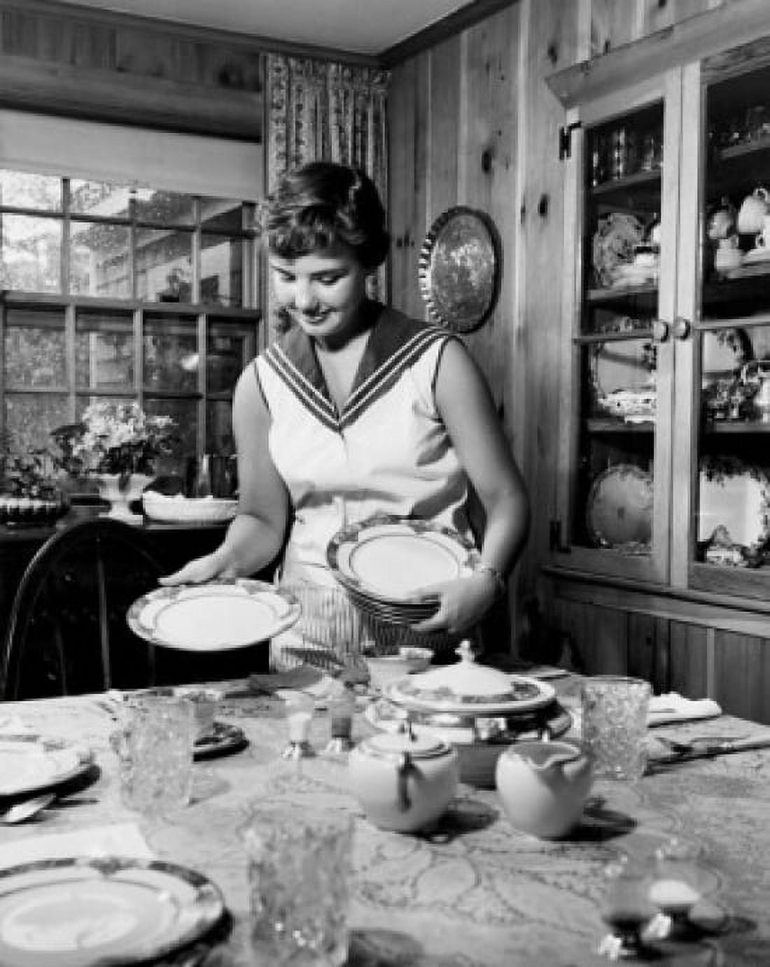 Teenage girl setting the dining table Canvas Art - (18 x 24)