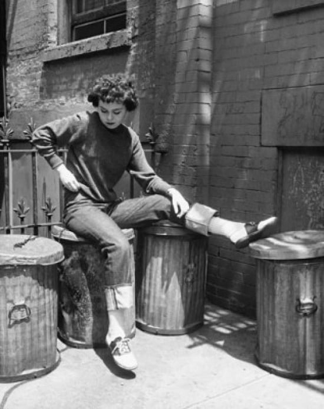 Teenage girl sitting on a garbage bin Canvas Art - (18 x 24)